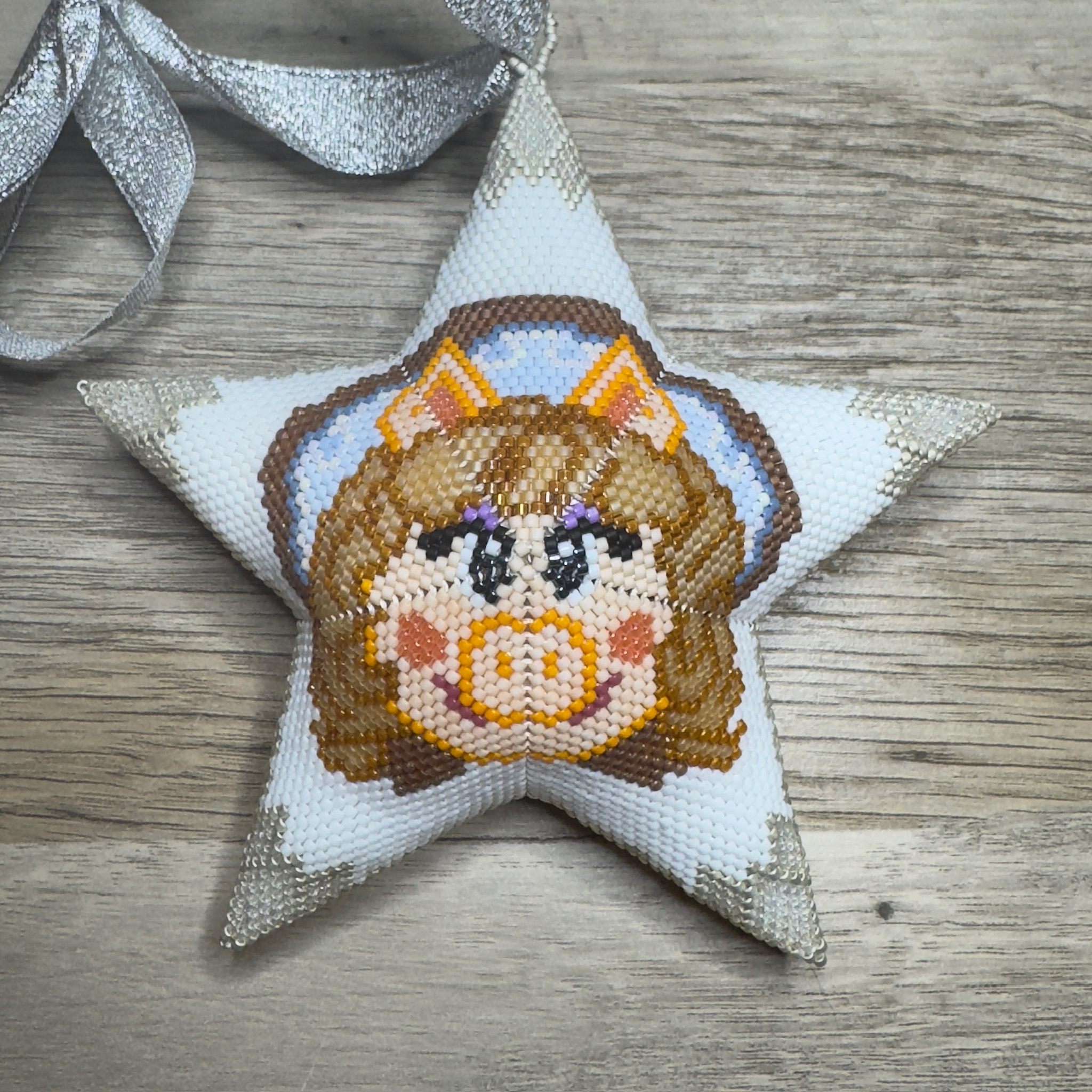 Beaded star ornament featuring Miss Piggy with silver ribbon